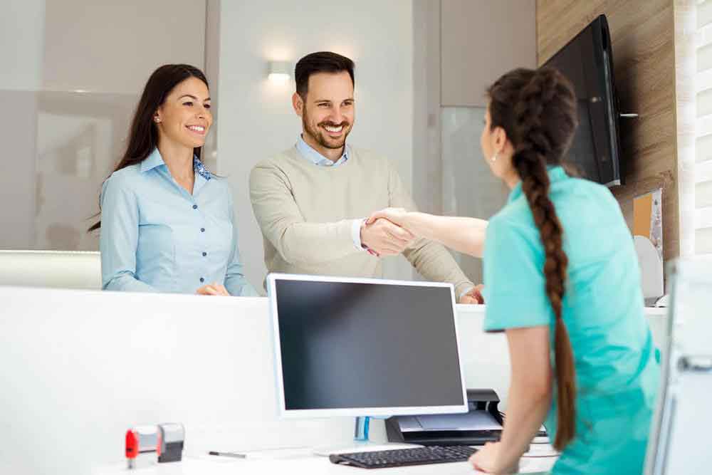 Receptionist greeting the guest in the office view