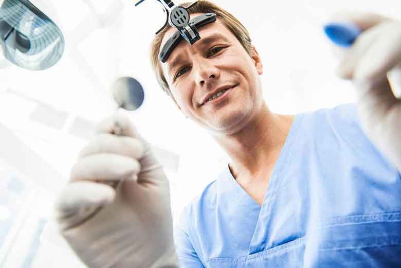 Dentist checking the patient with the instruments