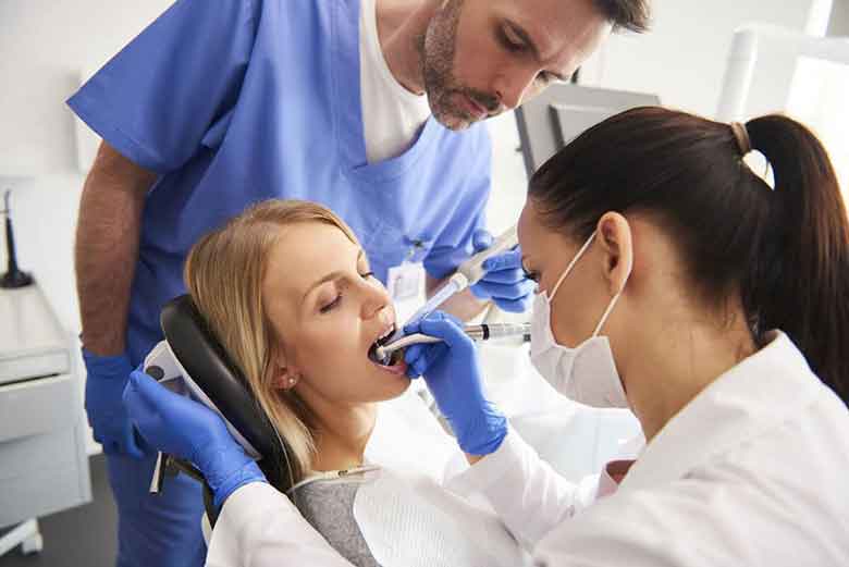 Dentist removing tooth