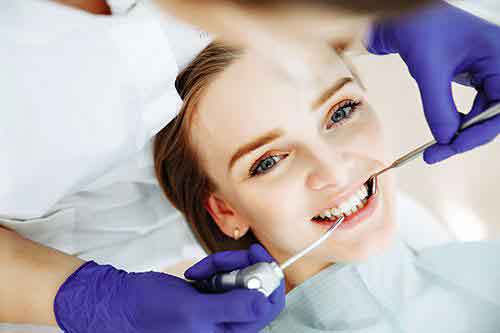 Dentist treating a women patient
