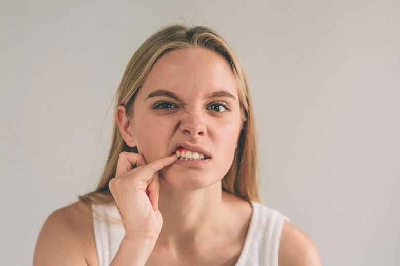 Girl Touching the Gums