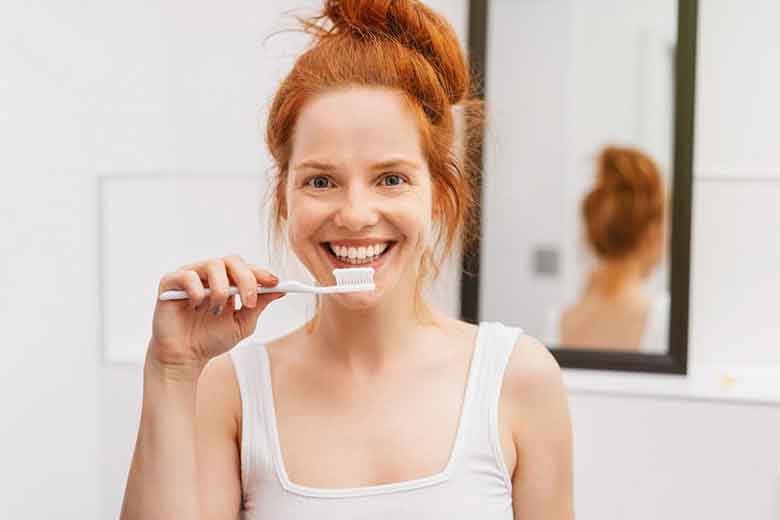 Women handling toothbrush in her hand