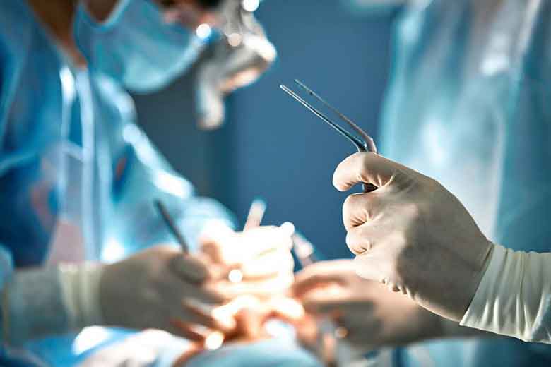 Dentist using scissors in operation 