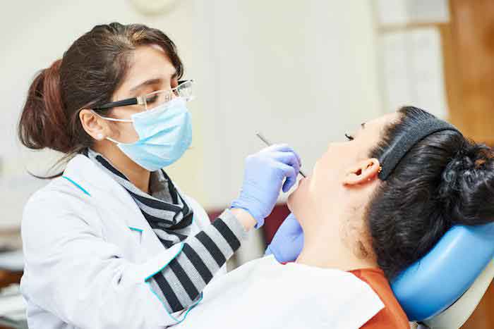 Dentist removing tooth