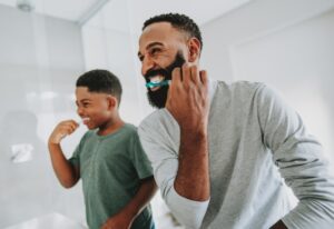 A man and his son brush their teeth in Parker, CO