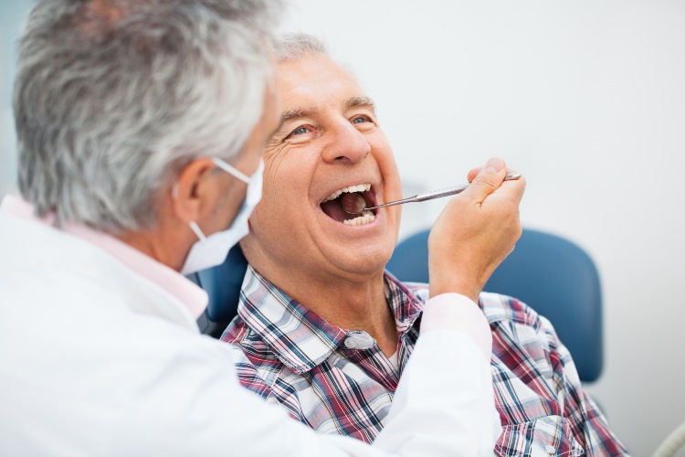 Man Being consulted for Gum Graft Recovery